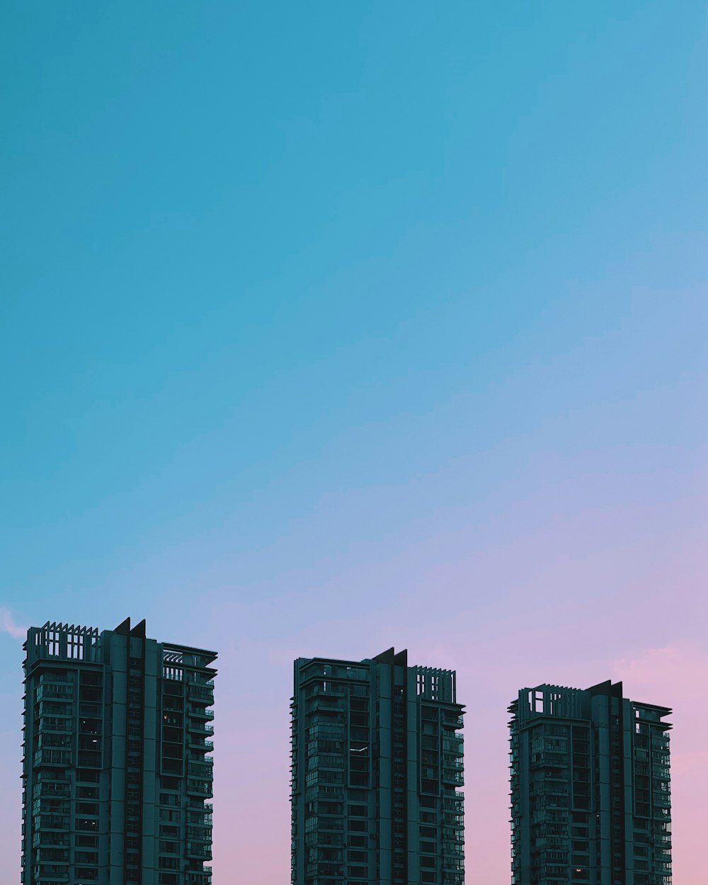 three high rise buildings