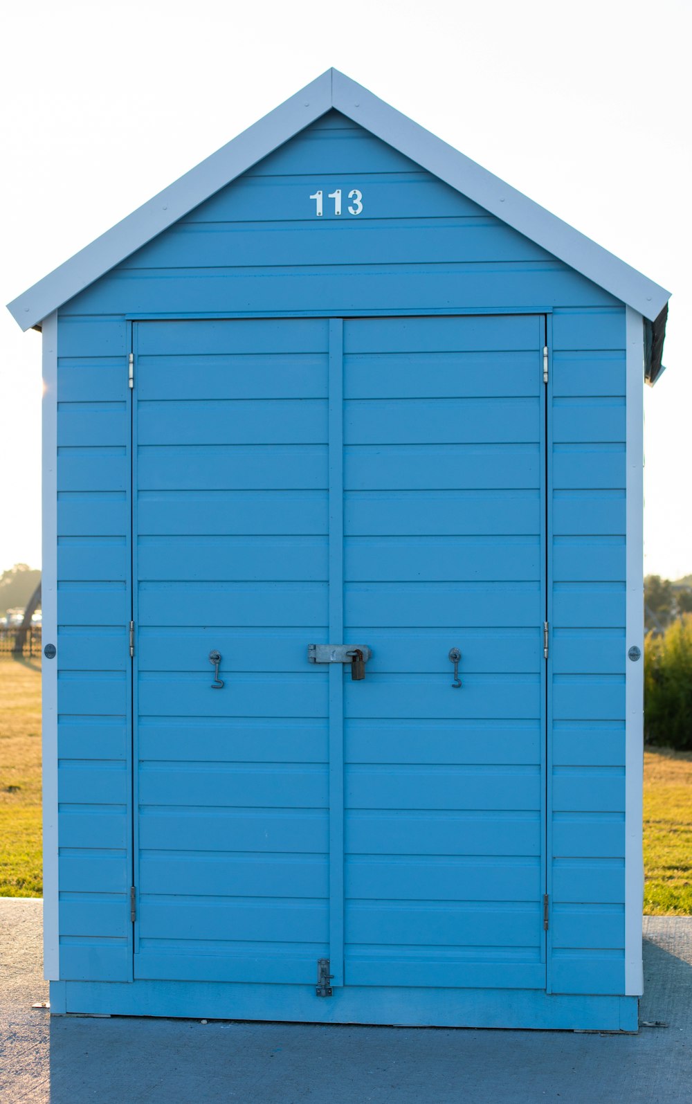 blue wooden tool shed