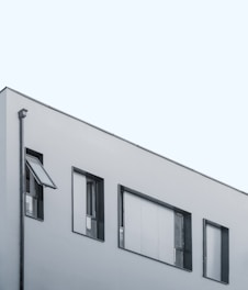 gray concrete building under clear blue sky