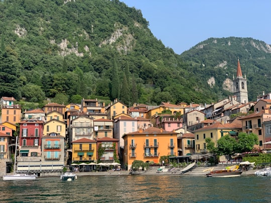 concrete buildings beside calm body of water in Lake Como Italy