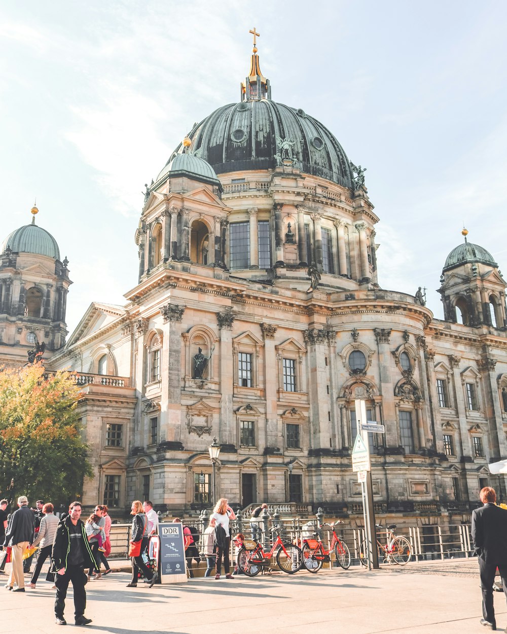 people near Berlin Cathedral in Germany under white and blue sky during daytime