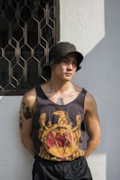 man leaning on wall