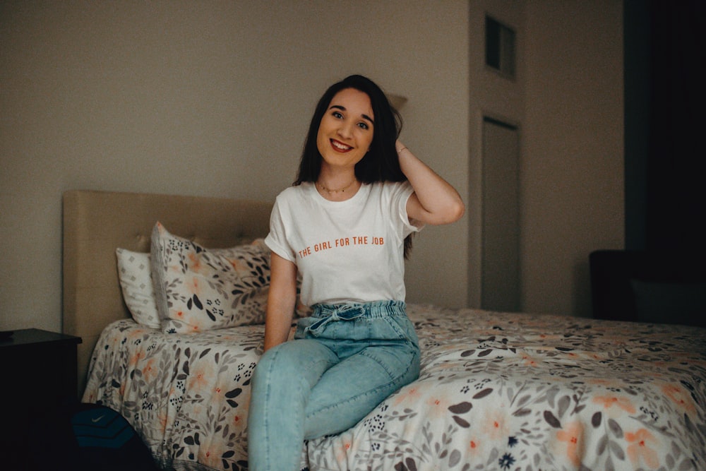 woman sitting on bed