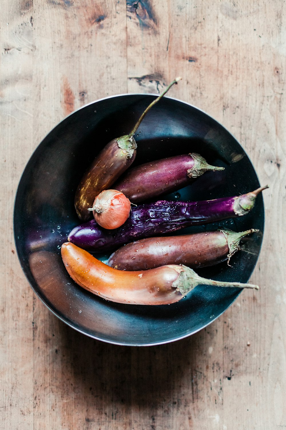 two brown and black vegetables