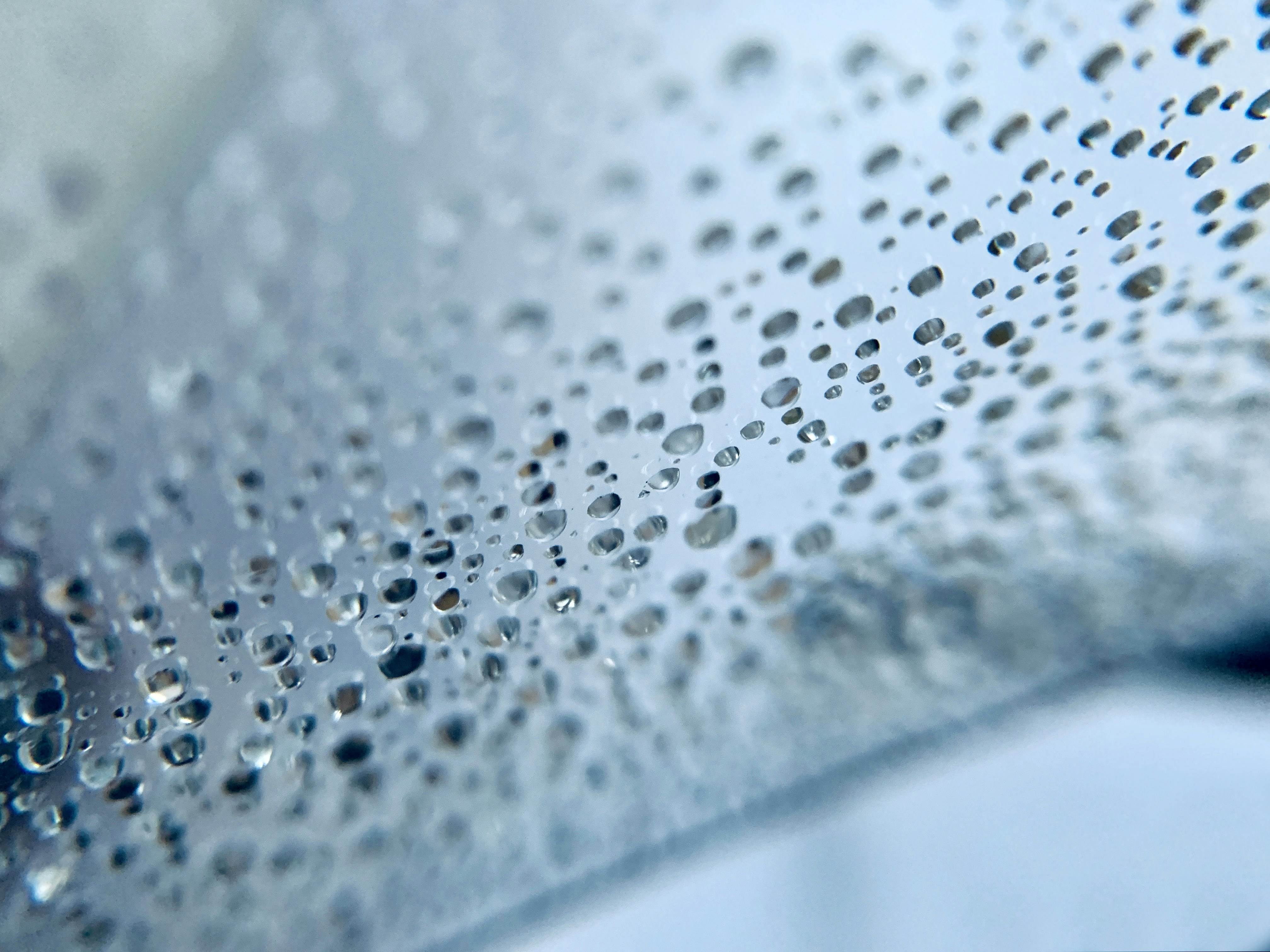 a close up of water droplets on a surface