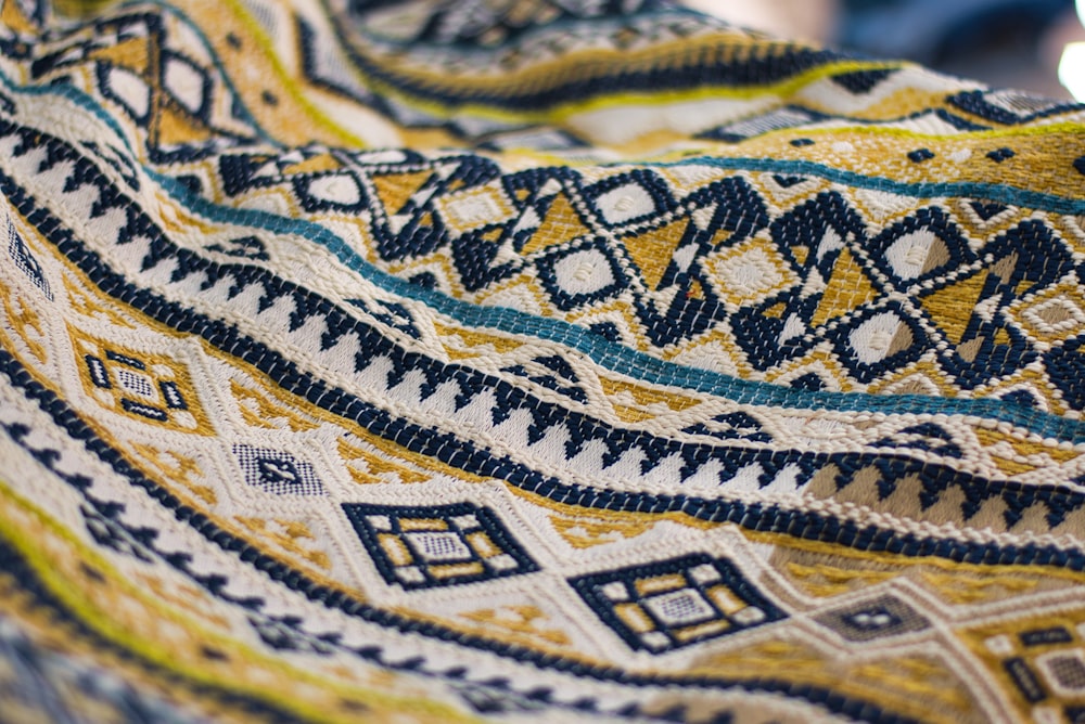 yellow, black, and white textile