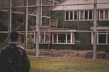 A home inspector examining the exterior of a residential house.