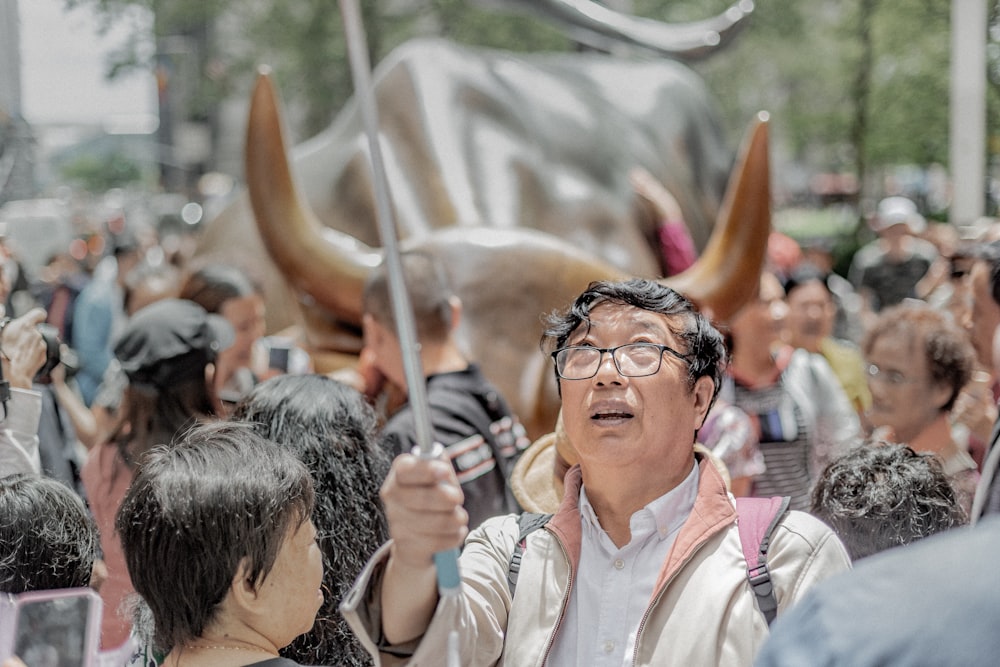 shallow focus photo of man in white jacket