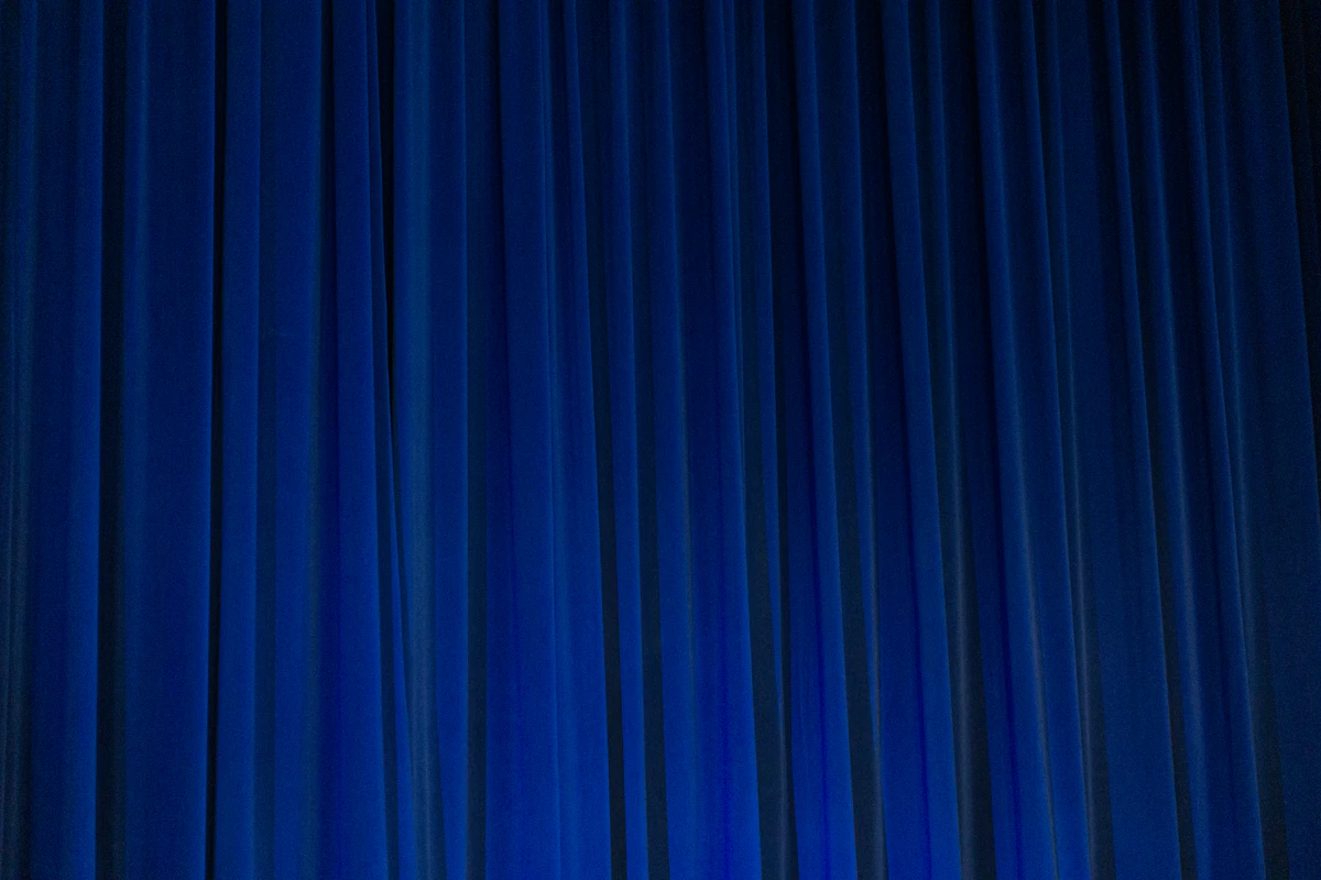 Sheer white curtains at a sunny window