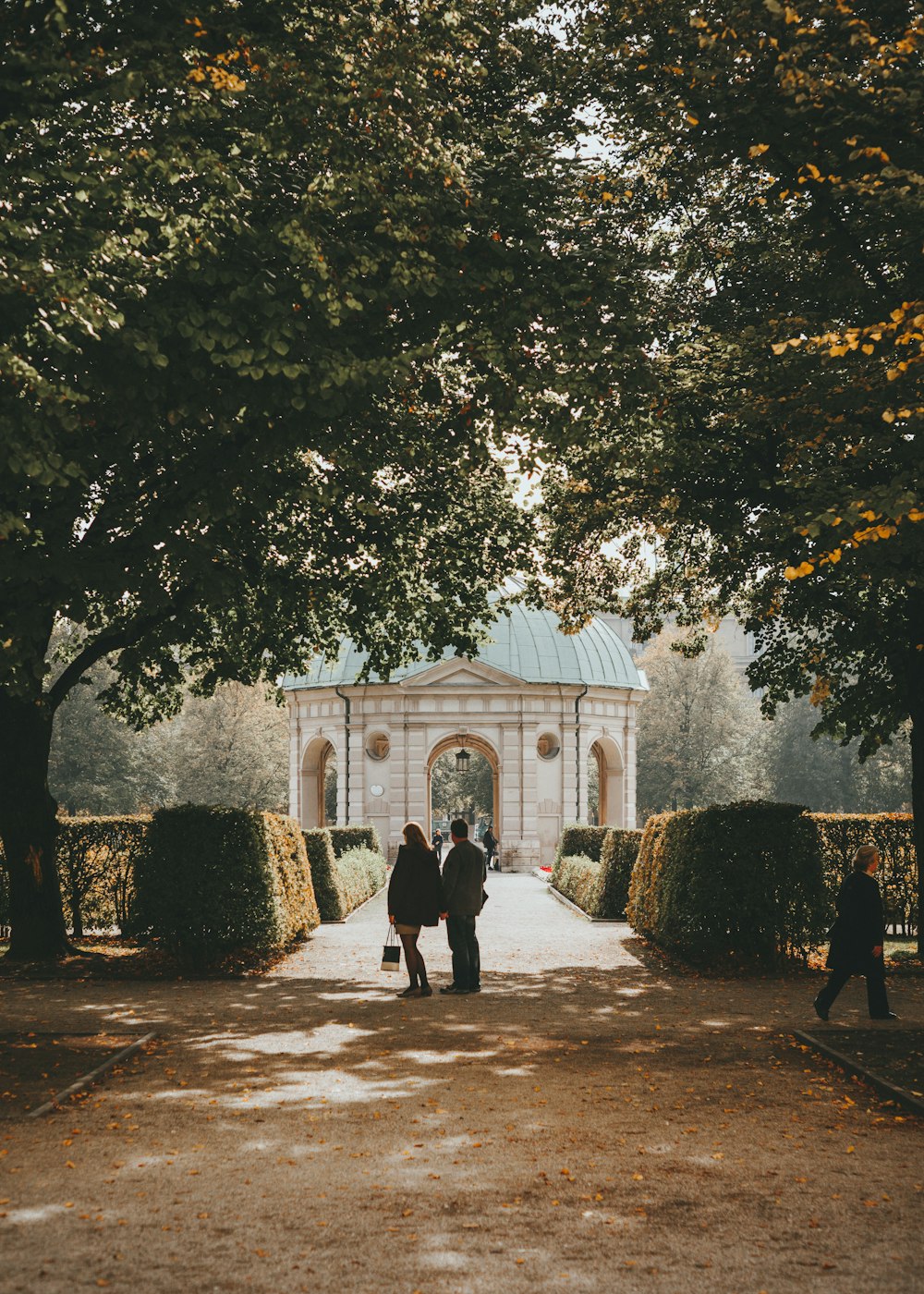 man and woman standing in front of dome building