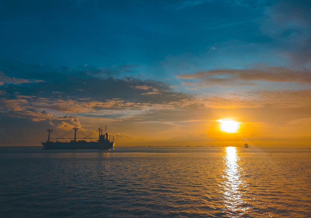 boat on body of water during golden hour