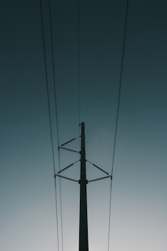 electrical post with cables during day