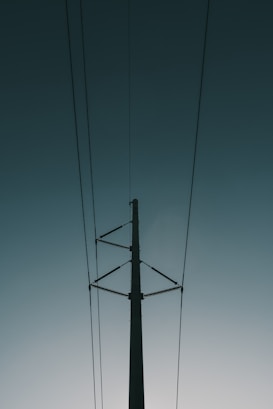 electrical post with cables during day