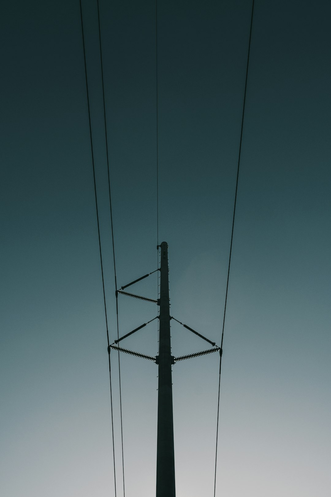 electrical post with cables during day