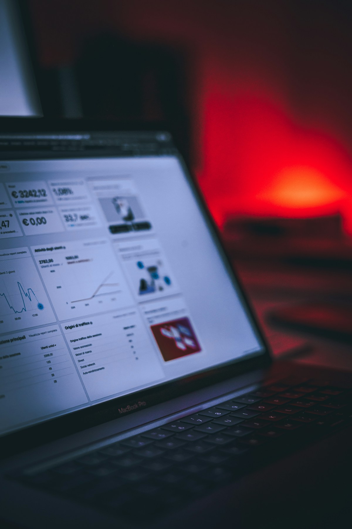 Person analyzing SEO data on multiple screens