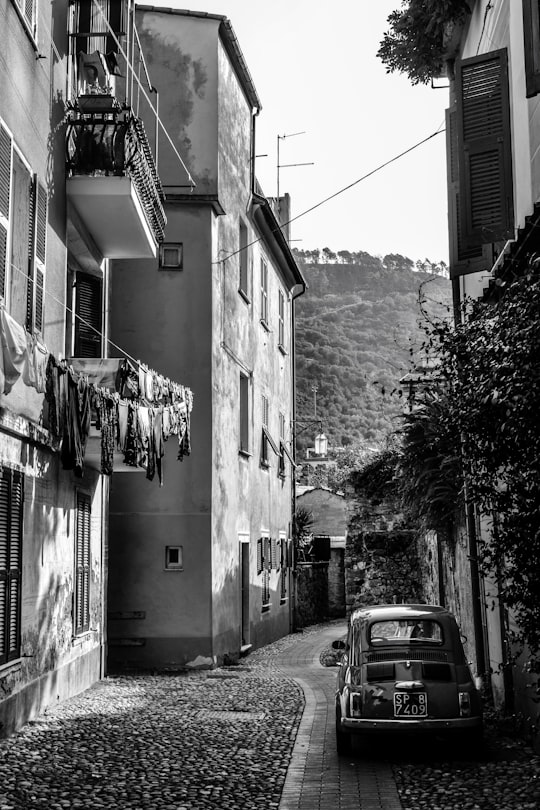 grayscale photography of vehicle on road in Levanto Italy