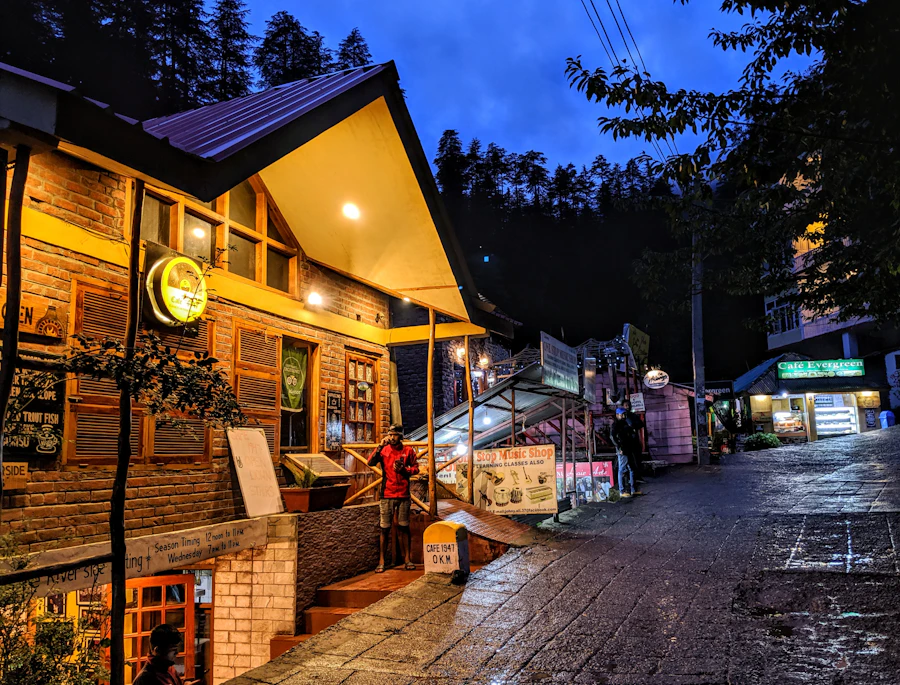 Wooden cottage at dusk among pine trees