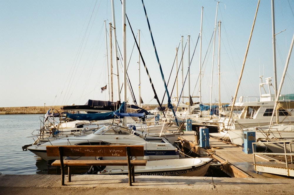 white boats on harbour during daytime