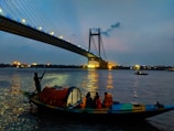 people riding boat on body of water during daytime