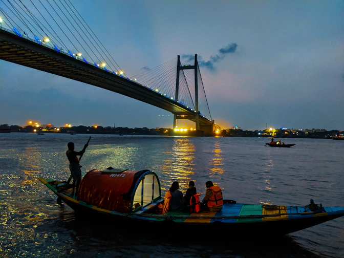 people riding boat on body of water during daytime