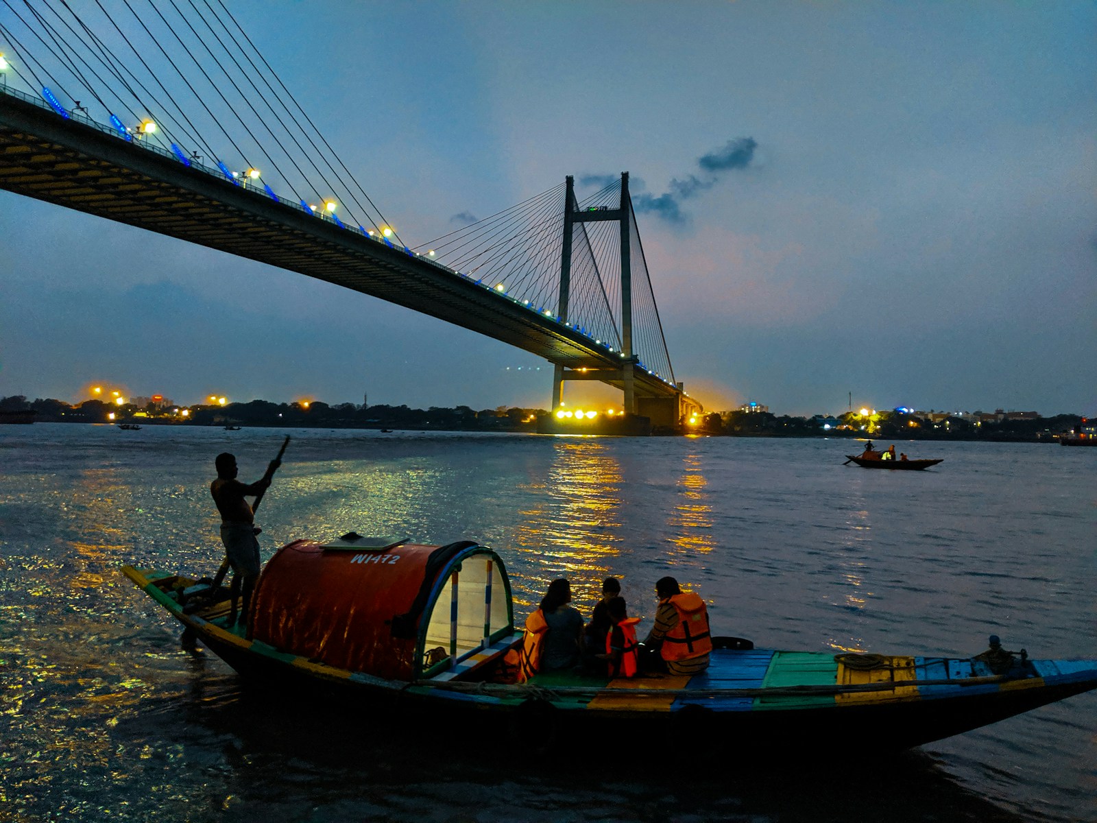 people riding boat on body of water during daytime