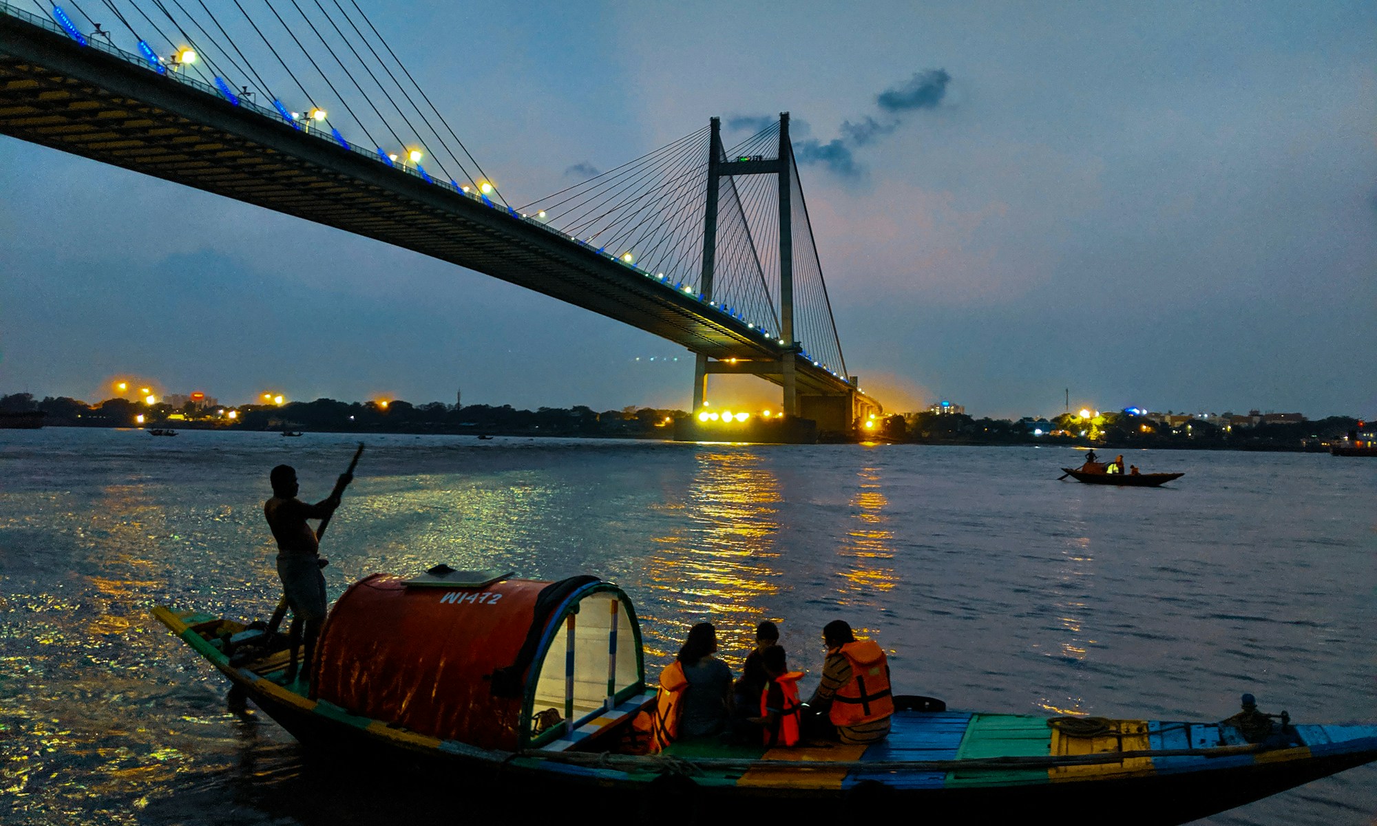 people riding boat on body of water during daytime