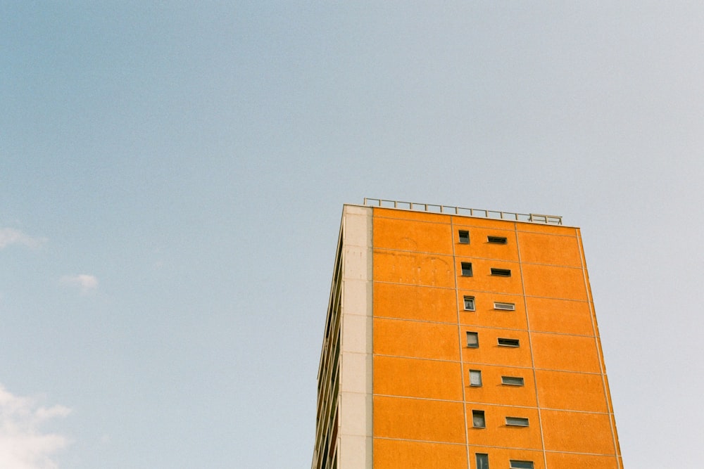 orange building under cloudy sky