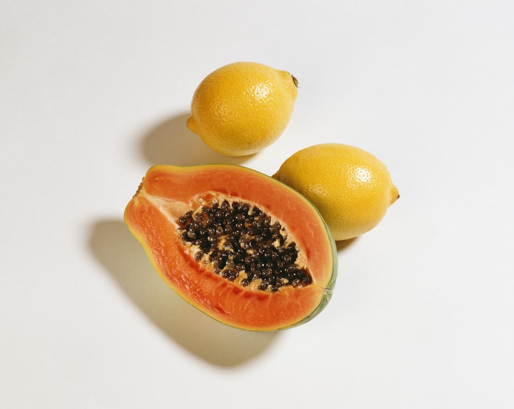 yellow papaya and two lemons