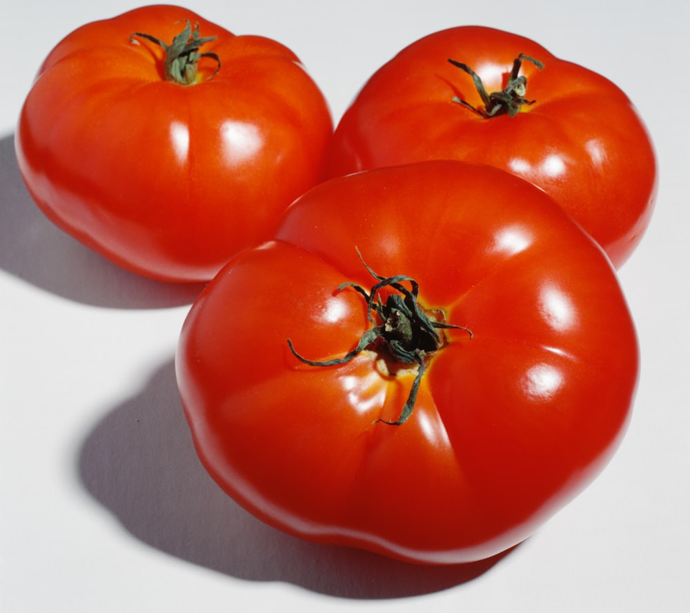 three red tomatoes