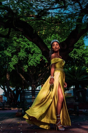 woman wearing yellow off-shoulder silt dress with silver tiara