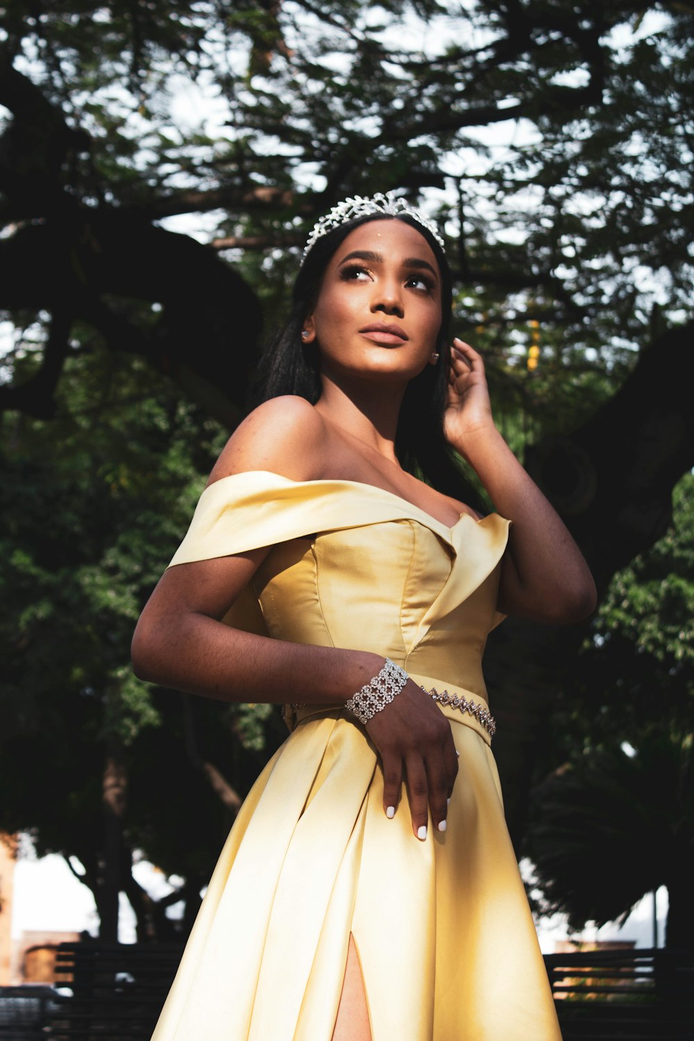 portrait of woman wearing yellow off-shoulder dress