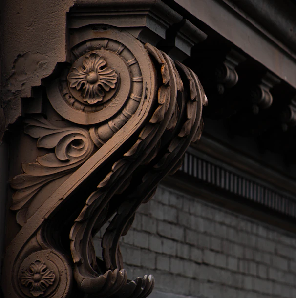 A close-up of a sculptural element integrated into a theatrical backdrop, highlighting craftsmanship and detail.