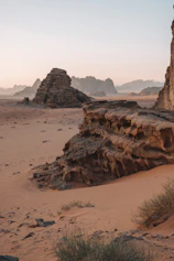 brown rock formation on brown field