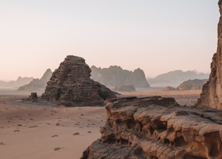 brown rock formation on brown field