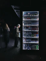 Technician installing a vending machine in a retail store, ensuring perfect placement.