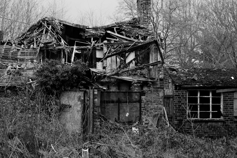 grayscale photo of wrecked house