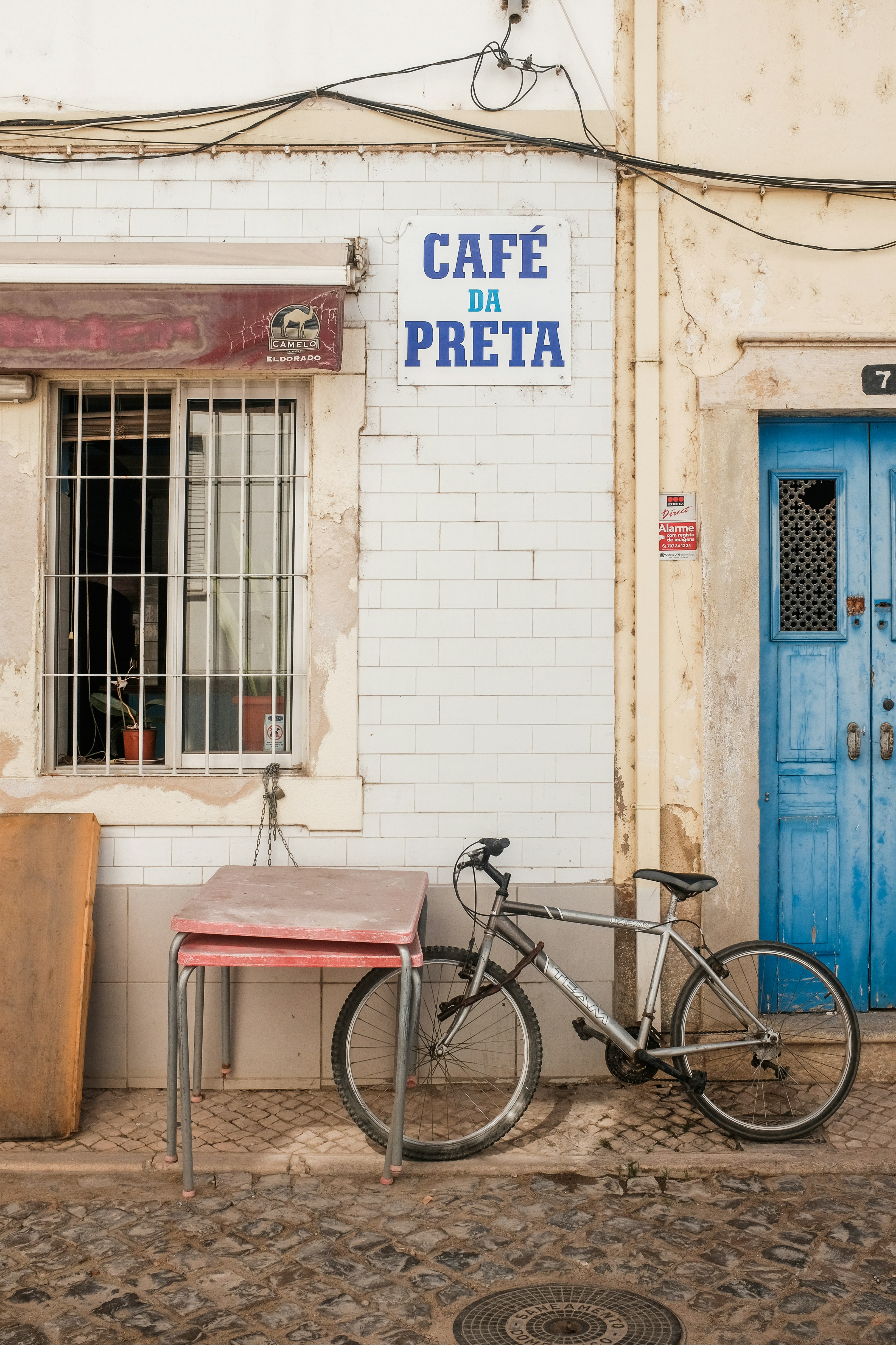 Bike Parked Near Blue Door Photo Free Machine Image On Unsplash