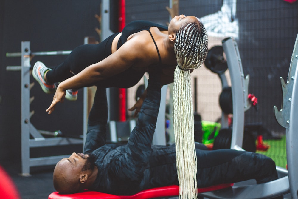 man lifting woman