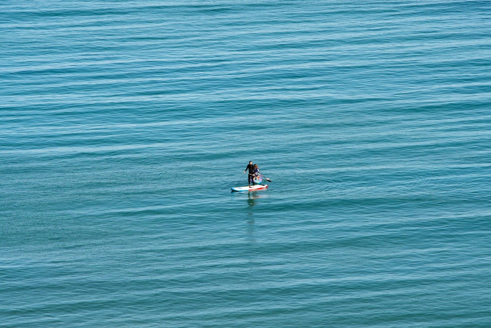 man on surfboard in water