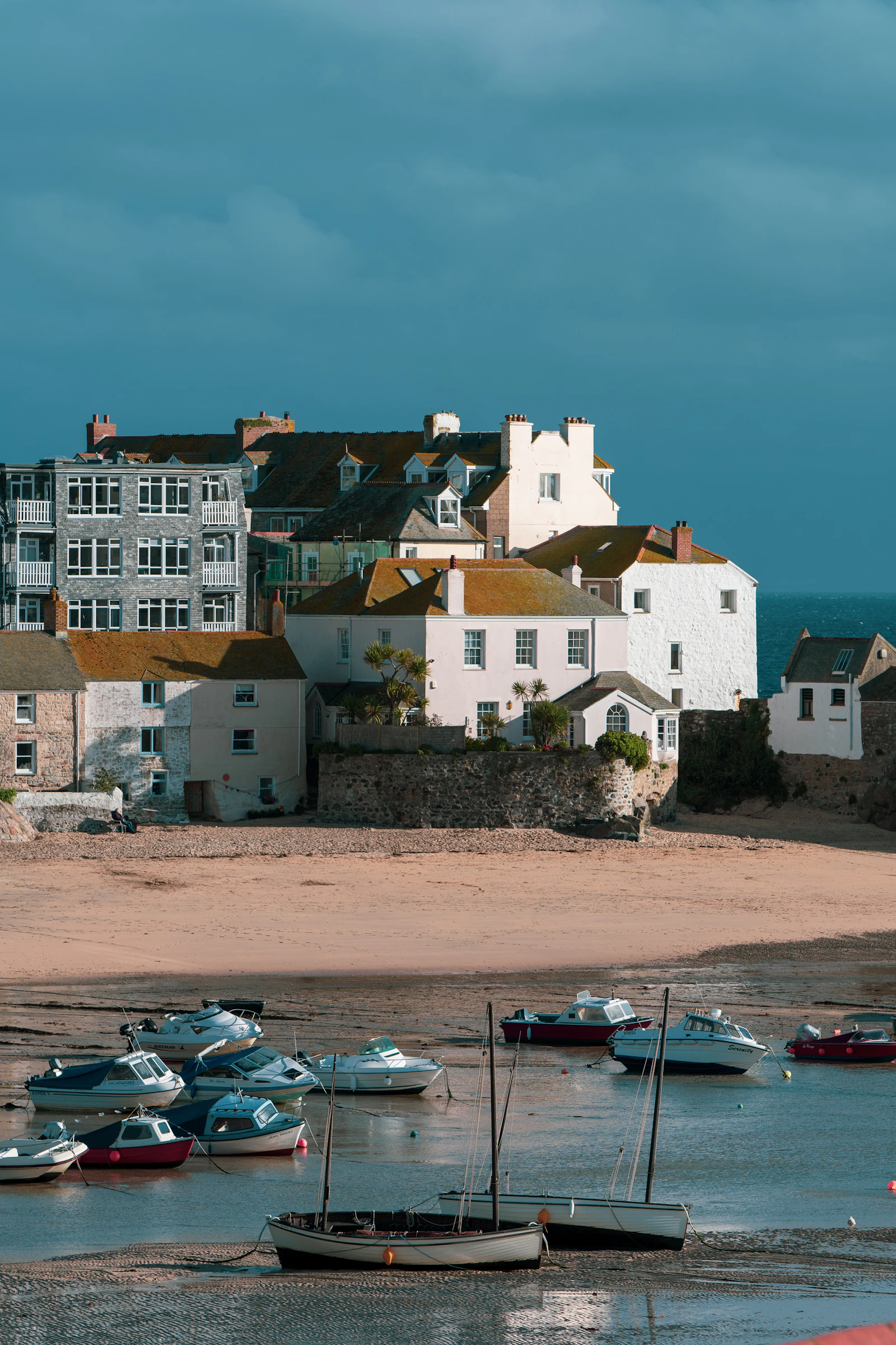 The harbour at St Ives, Cornwall, with fishing boats and the town behind.