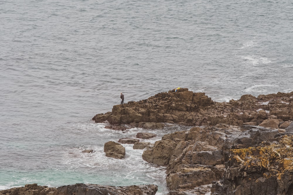 man standing on rock