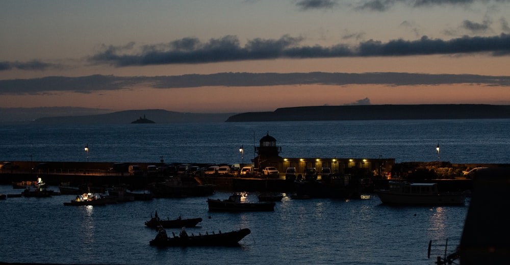 boats on blue sea during night time