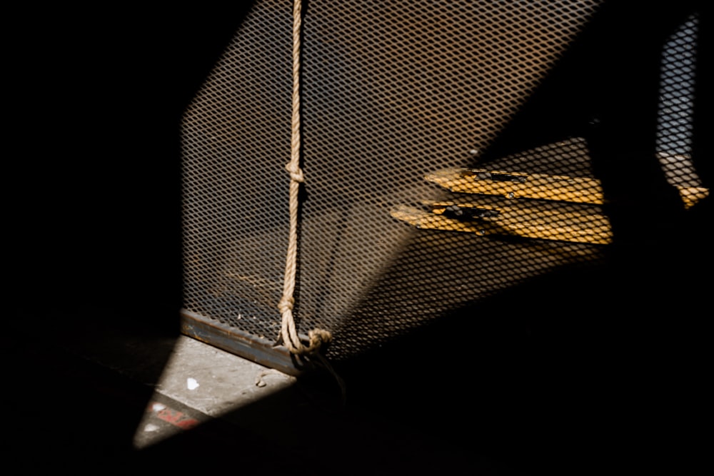 a yellow umbrella sitting on top of a metal pole