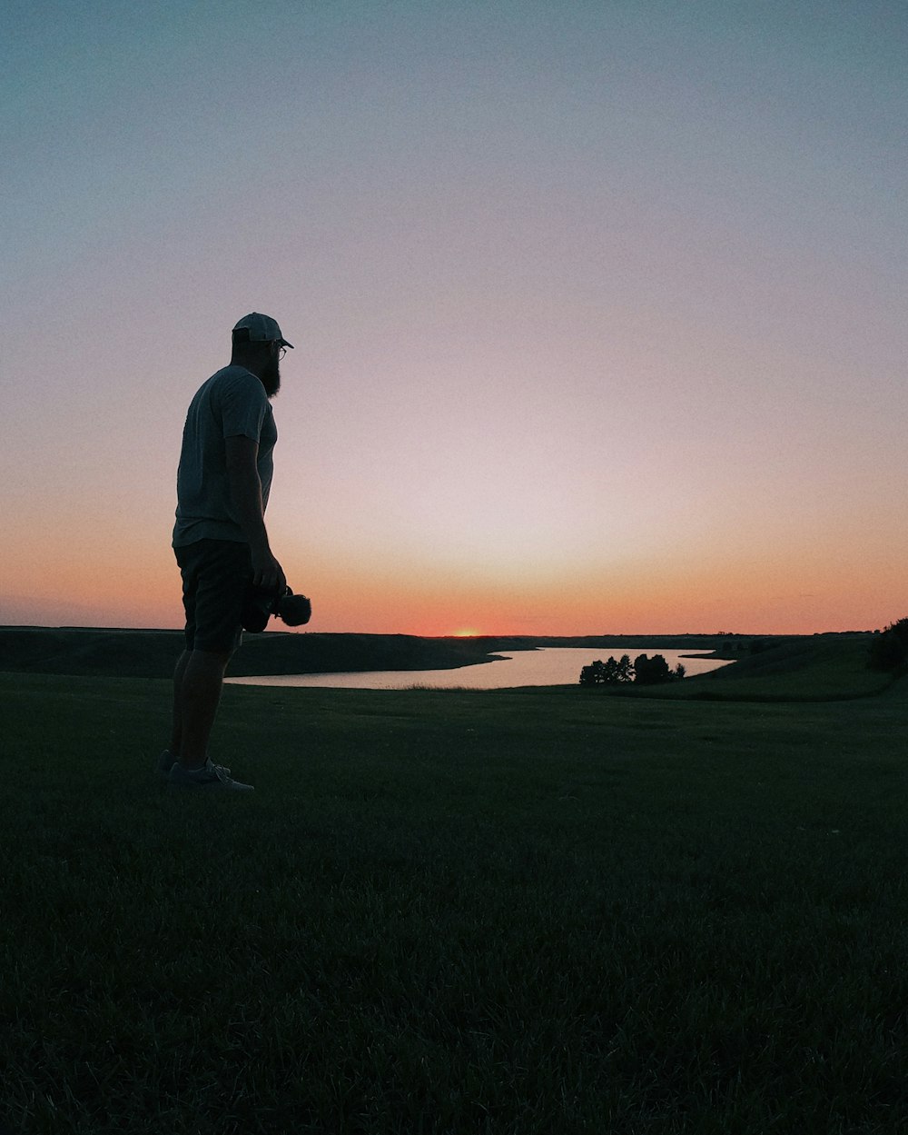 man standing near water