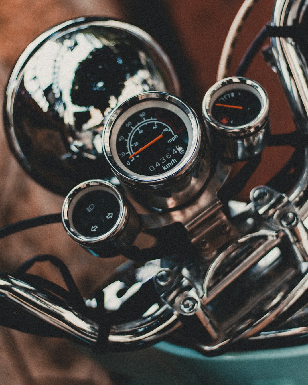 chrome-colored motorcycle gauge