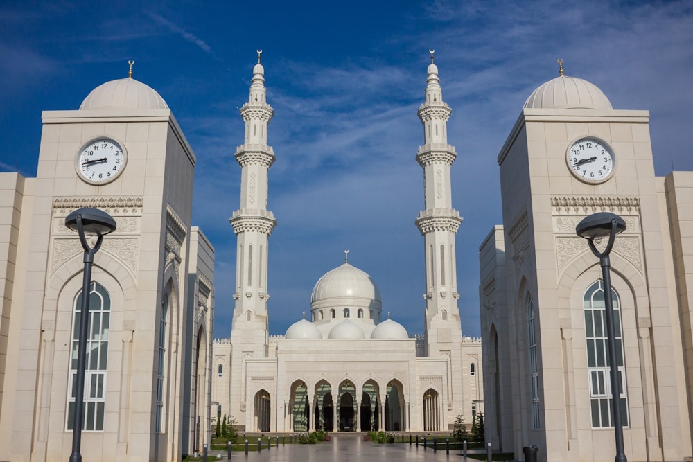 temple with two clock towers during day