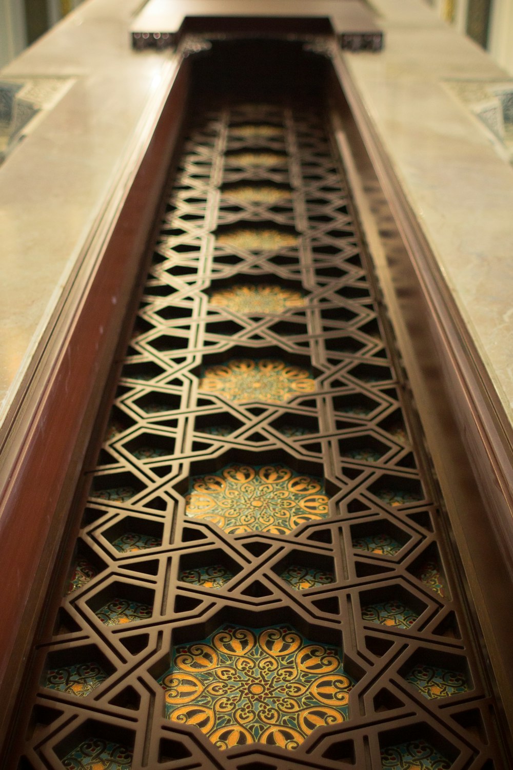 a close up of a decorative metal door