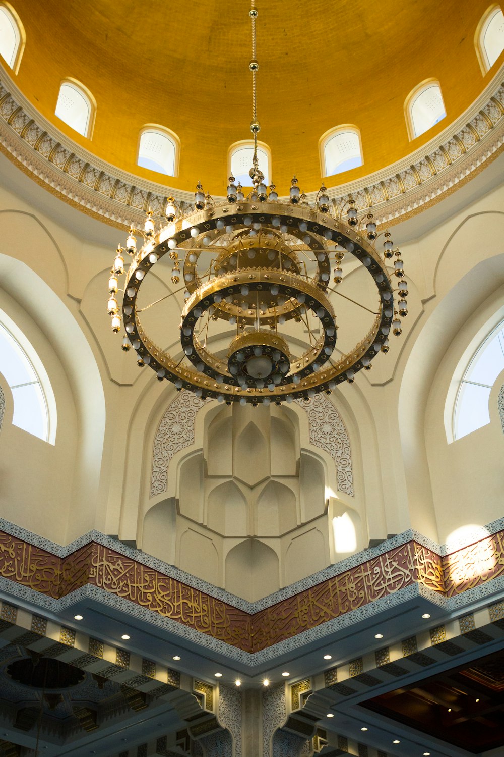 round gold-colored chandelier