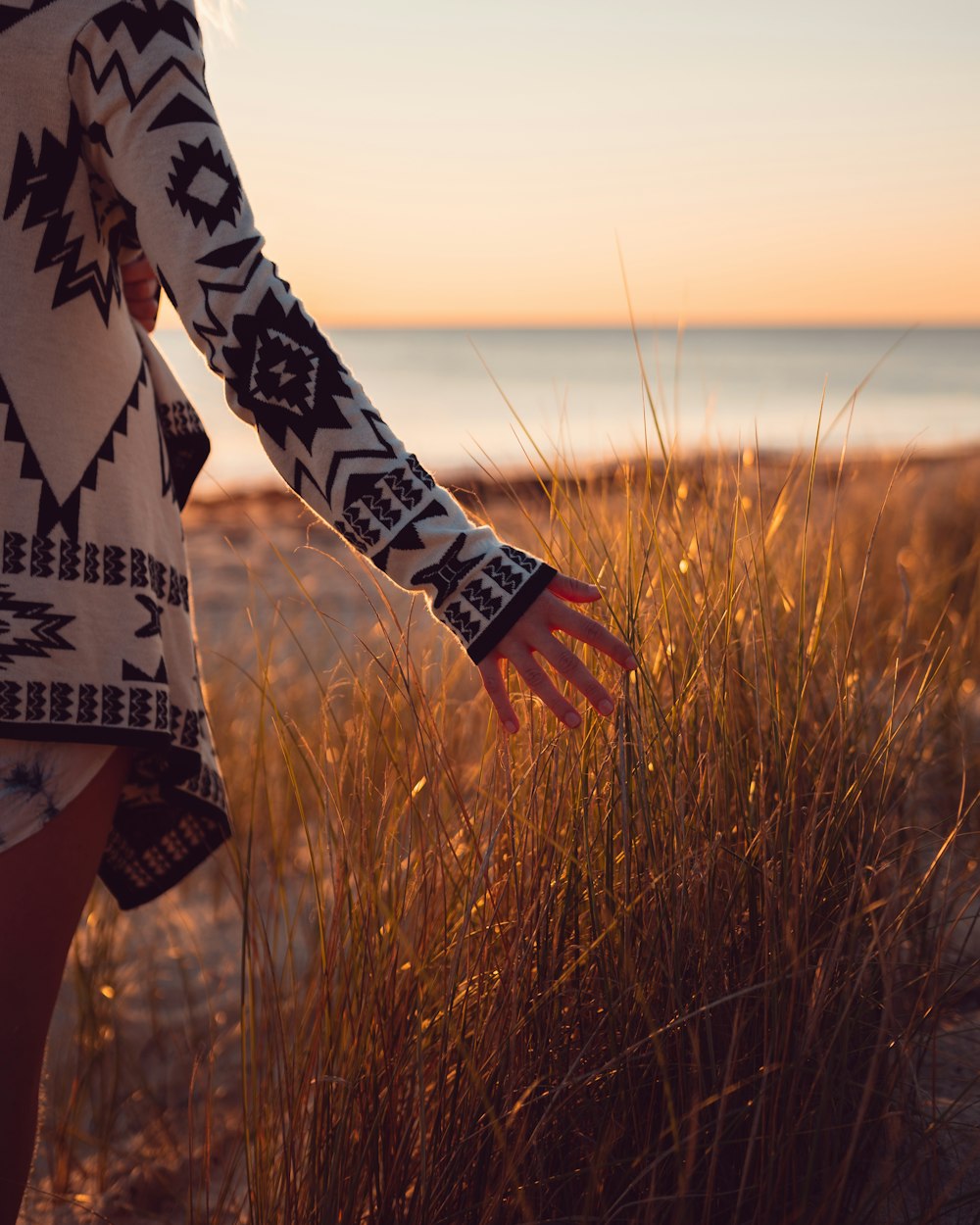 woman standing on seashore during day