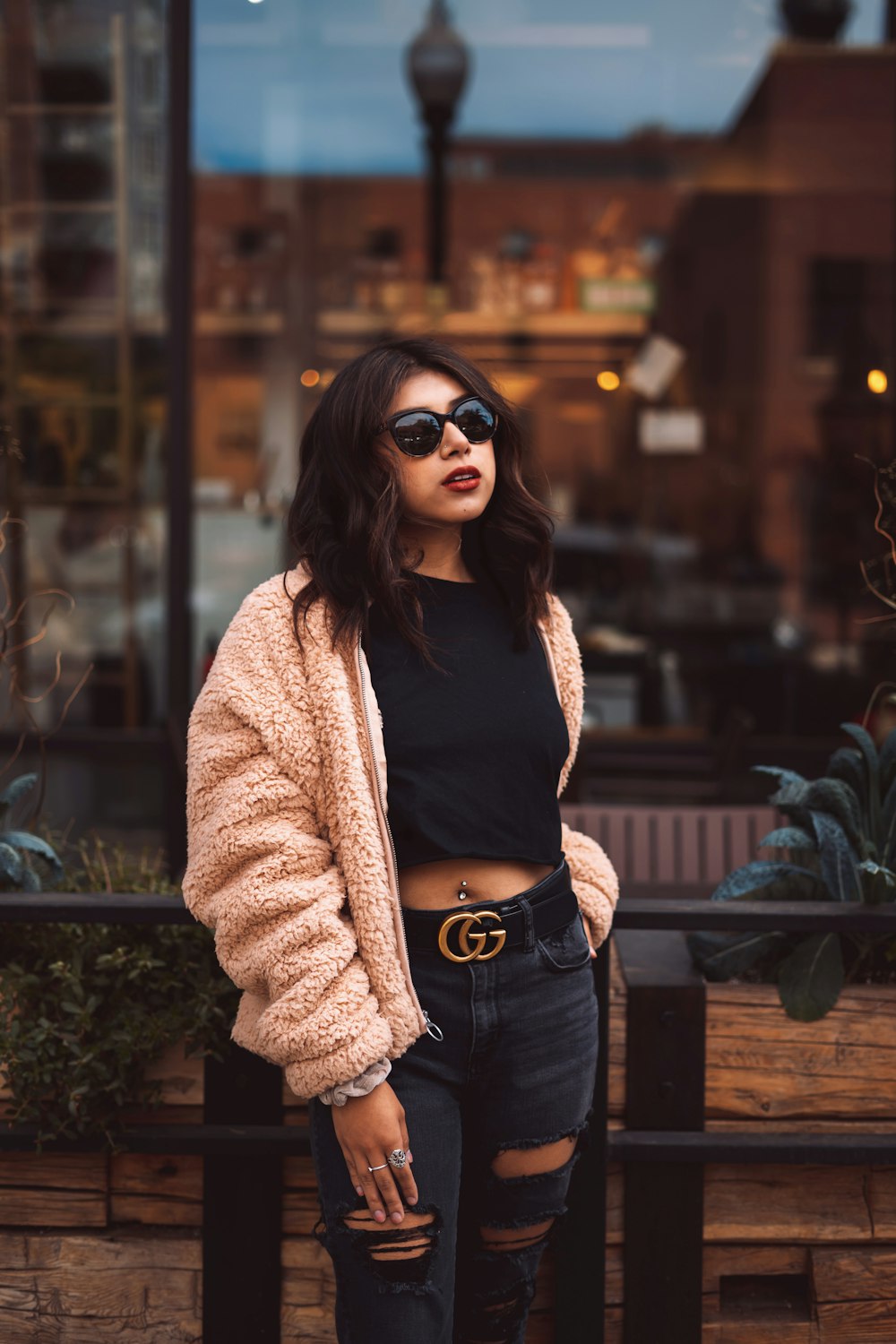 woman wearing black blouse and beige cardigan